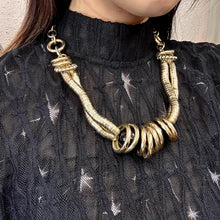 Vintage Gold Statement Necklace – Articulated Tube Segments with Black Glass Bead Centre